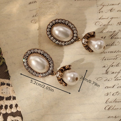 Boucles d'oreilles pendantes à cadre vintage et perles